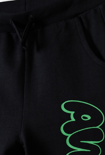 Dresowe spodnie slim dla chłopca - czarne z napisem Awesome