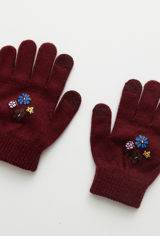 Dziewczęce rękawiczki swetrowe z kwiatowym nadrukiem.