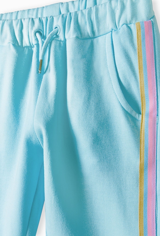 Niebieskie spodnie dresowe dla dziewczynki z lampasami