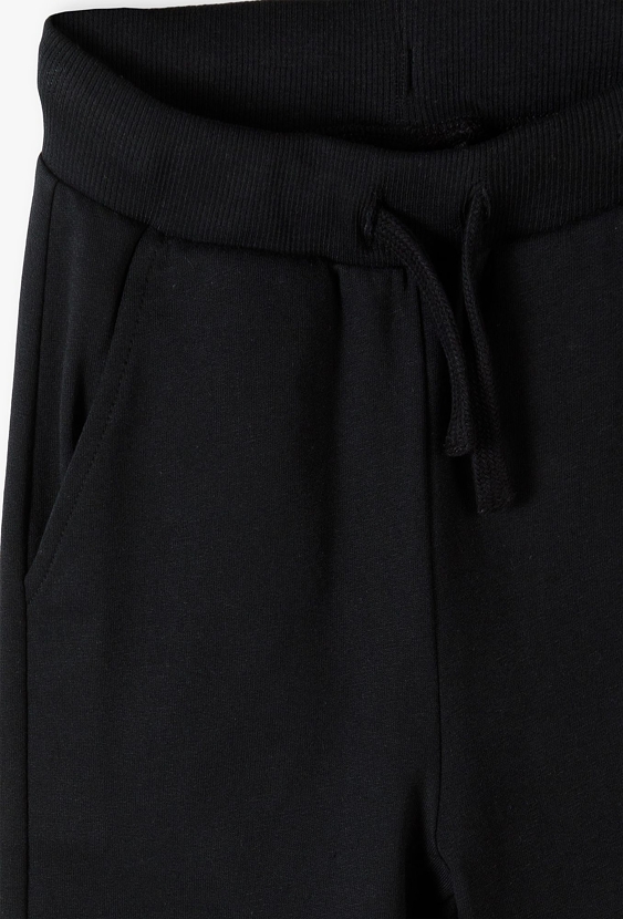 Czarne dresowe spodnie slim - 5.10.15.