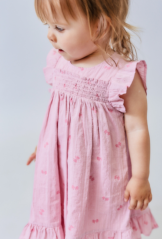 Sukienka niemowlęca z falbankami i kokardkami