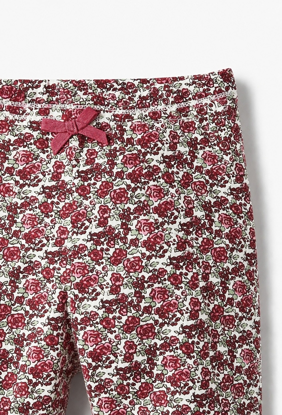 Legginsy niemowlęce z kwiatowym nadrukiem i kokardką