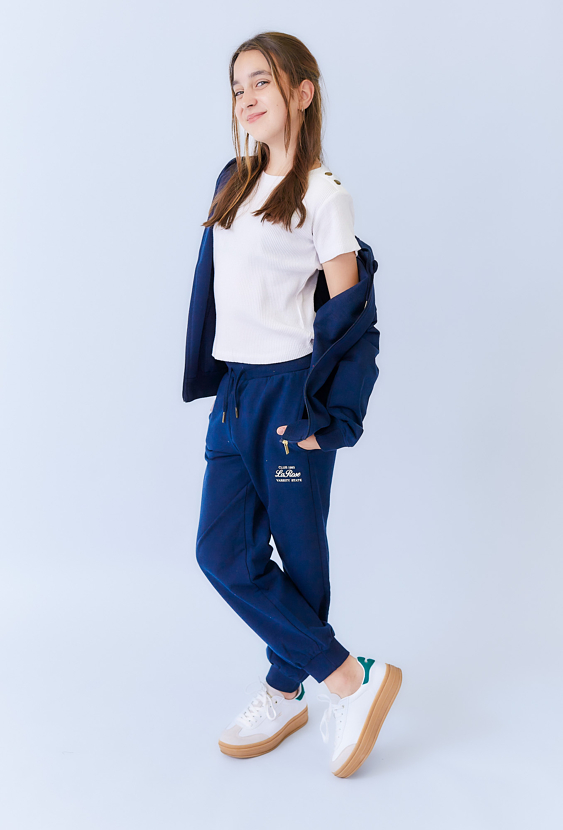 Spodnie dresowe dziewczęce granatowe z nadrukiem.