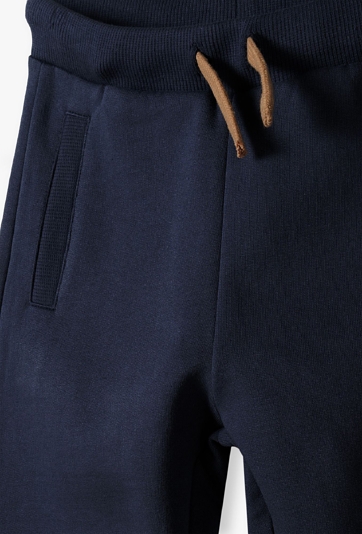 Ocieplane chłopięce spodnie dresowe -granatowe