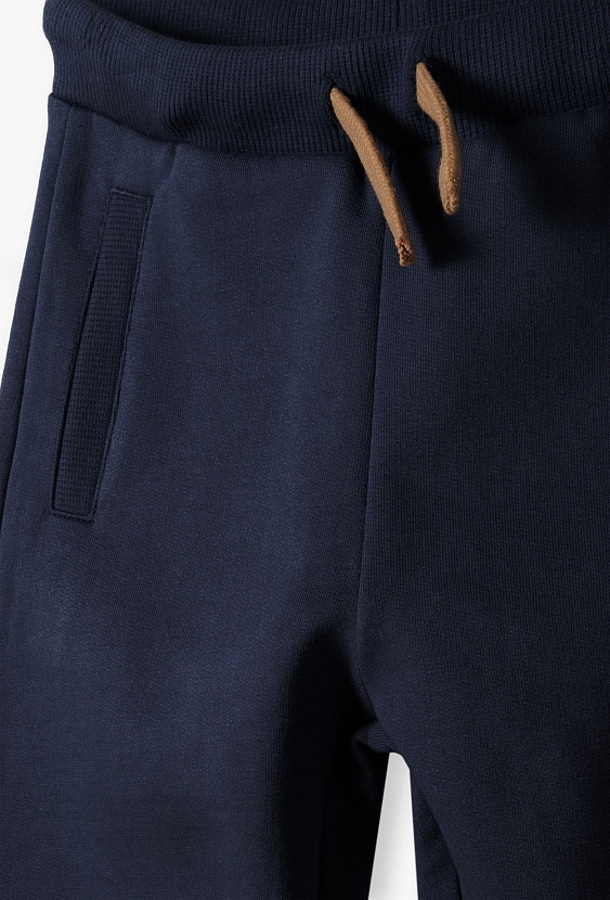 Ocieplane chłopięce spodnie dresowe -granatowe