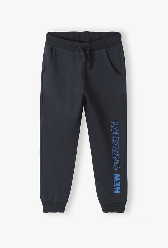 Czarne dzianinowe spodnie dresowe dla chłopca - New generation