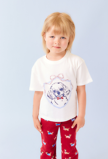 Koszulka dziewczęca ecru z nadrukiem psa – luźny krój.