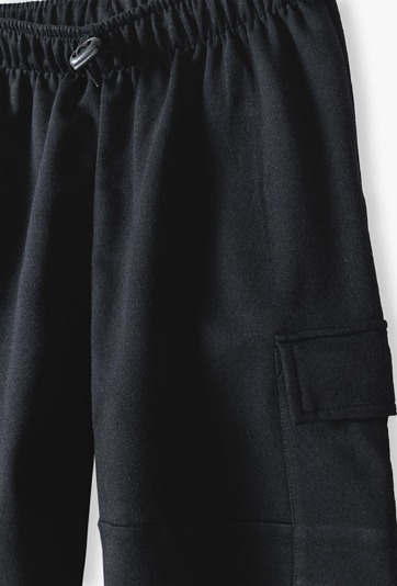 Czarne spodnie dziewczęce typu cargo