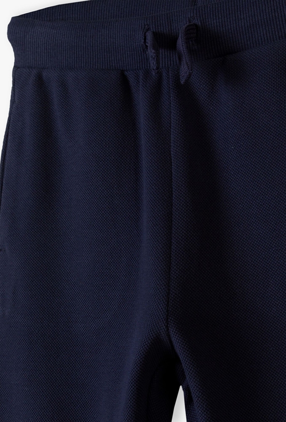 Granatowe spodnie dresowe pique dla chłopca - 5.10.15.