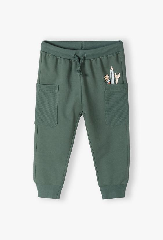 Zielone bawełniane spodnie dresowe niemowlęce z kieszonkami