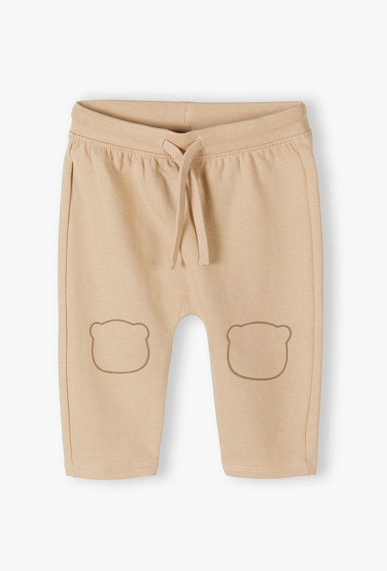 Beżowe bawełniane spodnie dresowe niemowlęce