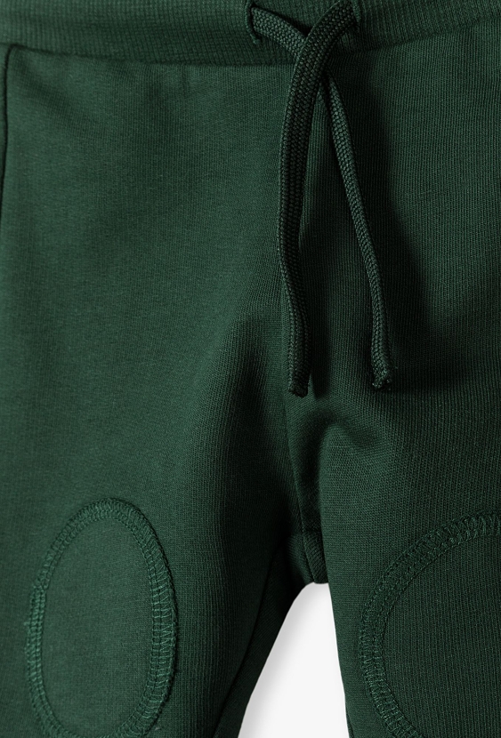 Zielone bawełniane spodnie dresowe niemowlęce - 5.10.15.