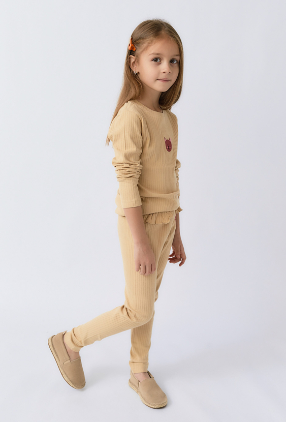 Dziewczęce prążkowane legginsy z falbanką i aplikacją kotka