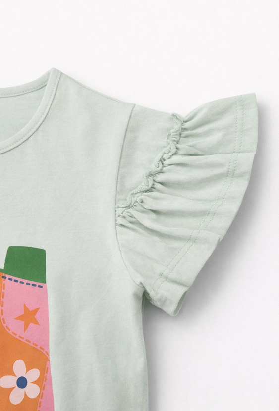 Koszulka dla dziewczynki z falbanką i nadrukiem kowbojek