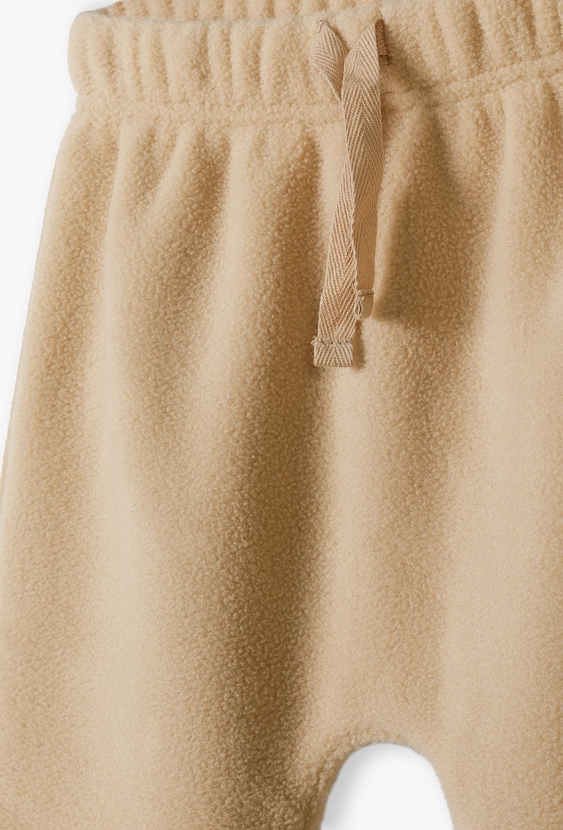 Beżowe spodnie dresowe niemowlęce