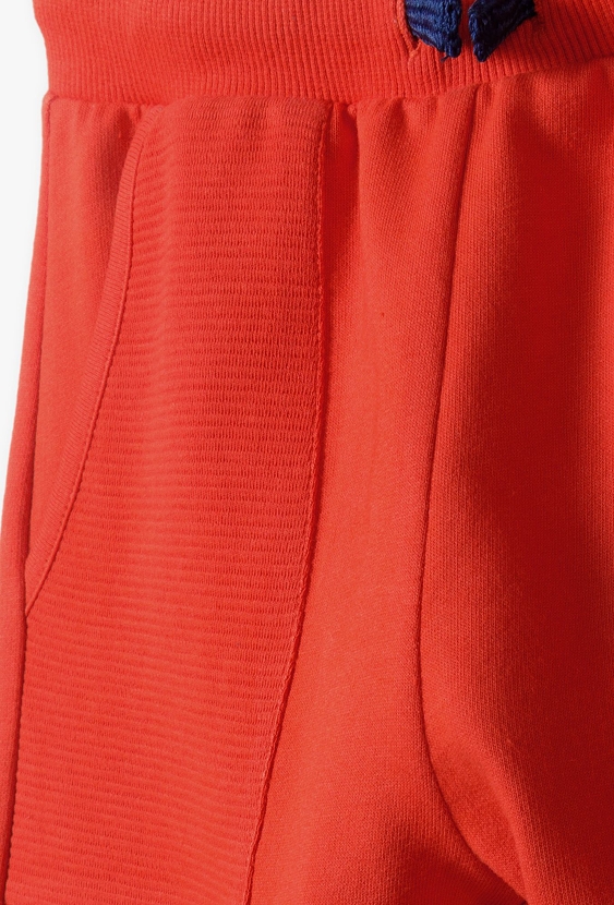 Pomarańczowe spodnie dresowe bawełniane dla chłopca