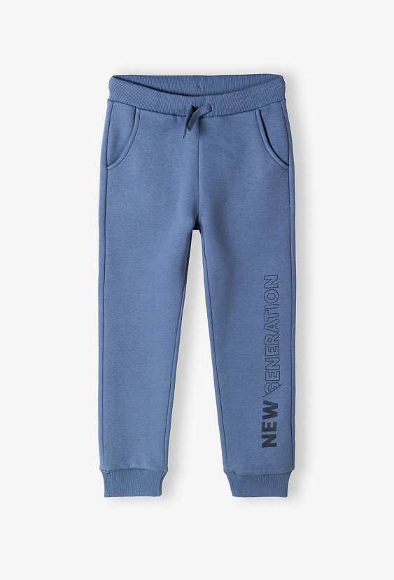 Spodnie dresowe niebieskie z napisem na nogawce- New generation