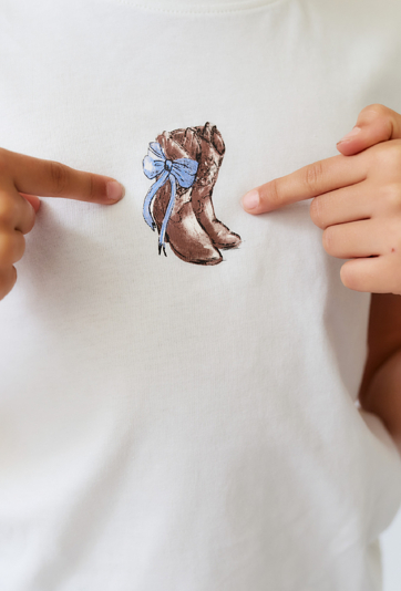 Koszulka dziewczęca ecru z drobnym nadrukiem wodnym.