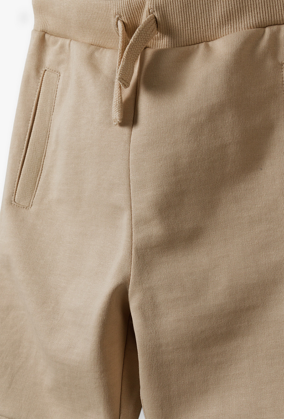 Spodnie dresowe dla chłopca - beżowe - 5.10.15.