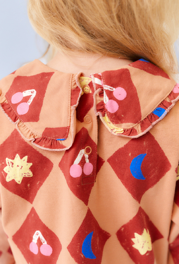 Pomarańczowa sukienka z cyrkowym nadrukiem - Limited Edition