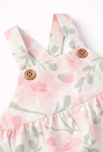 Niemowlęcy pajac dla dziewczynki w kwiaty