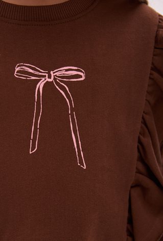 Bluza dziewczęca z falbanami i brokatowym nadrukiem kokardki