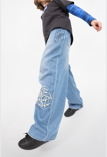 Jeansy wide leg z nadrukami graffiti