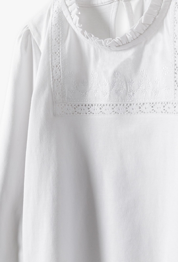 Biała elegancka dzianinowa bluzka dla dziewczynki