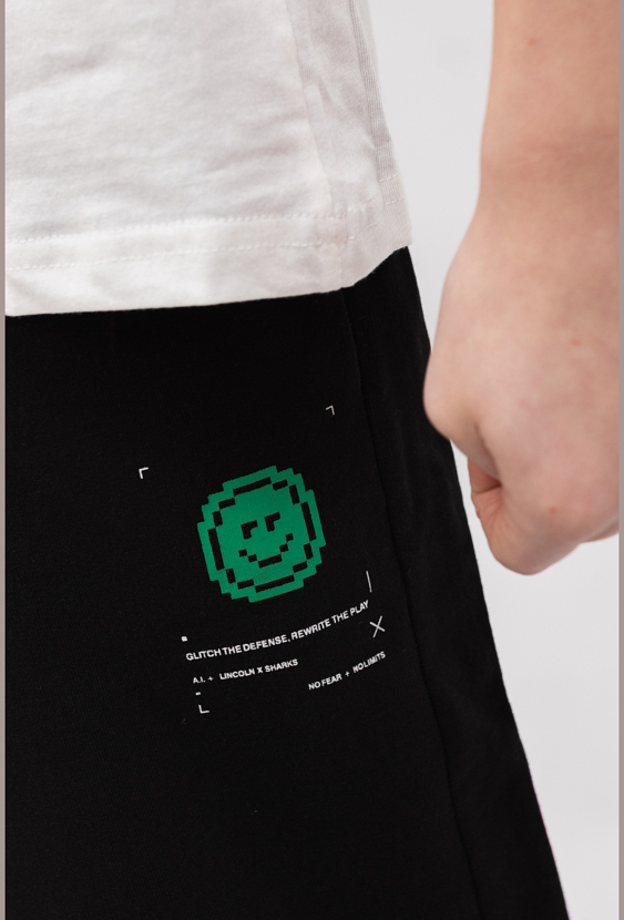 Spodnie dresowe chłopięce wide leg z napami i pikselowym printem