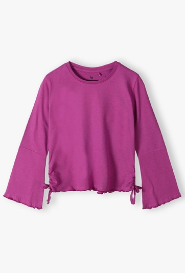 Różowa bluzka dziewczęca z rozszerzanymi rękawami