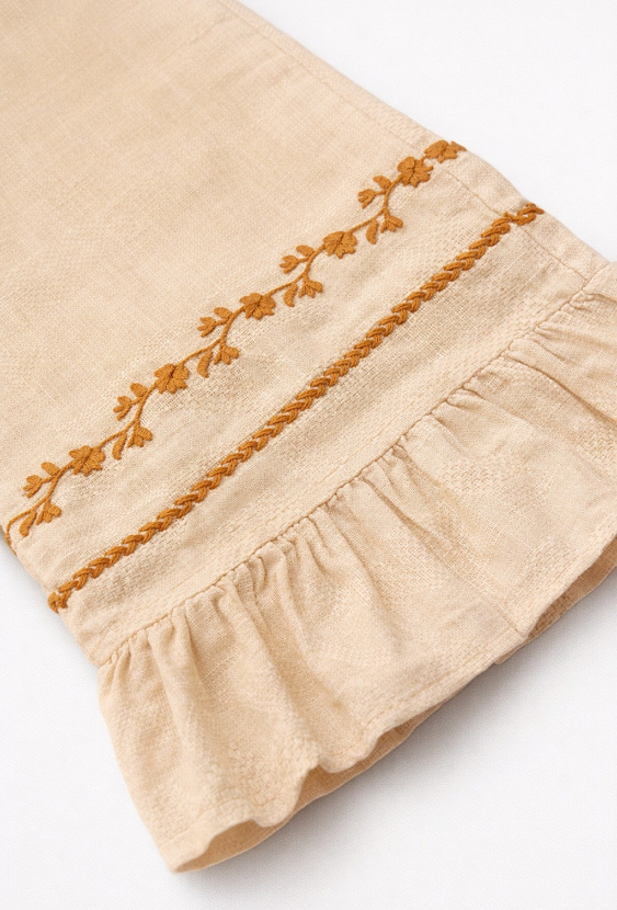 Spodnie flare wide leg z haftem i falbanką