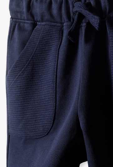 Granatowe spodnie dresowe dla niemowlaka - 5.10.15.