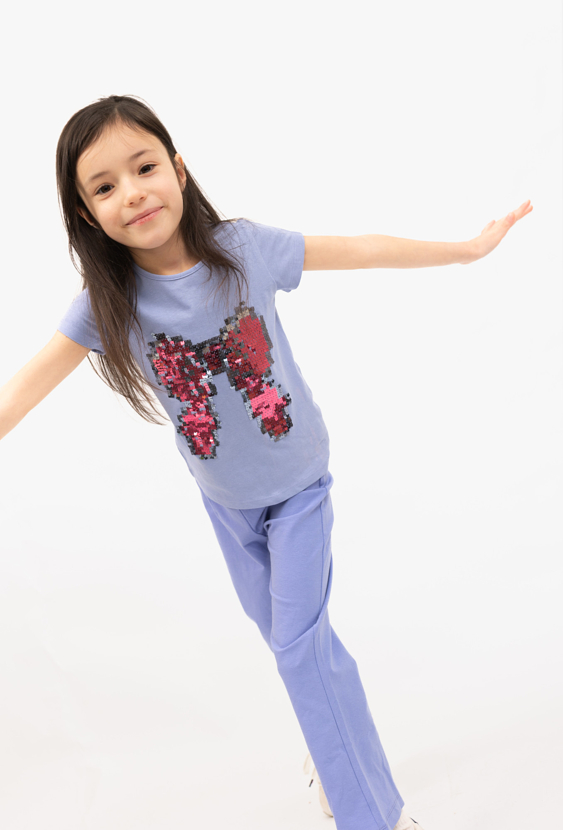 Koszulka dziewczęca z cekinową kokardą