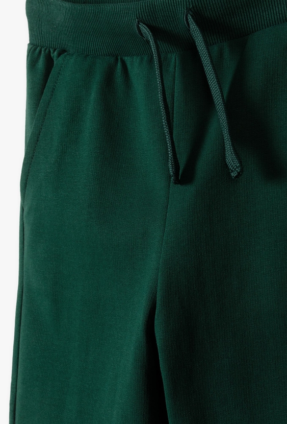 Spodnie dresowe w kolorze butelkowej zieleni - 5.10.15.