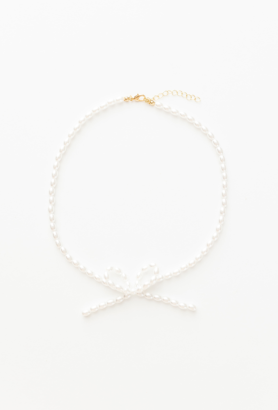 Naszyjnik z perełek z kokardką – biżuteria dla dziewczynki