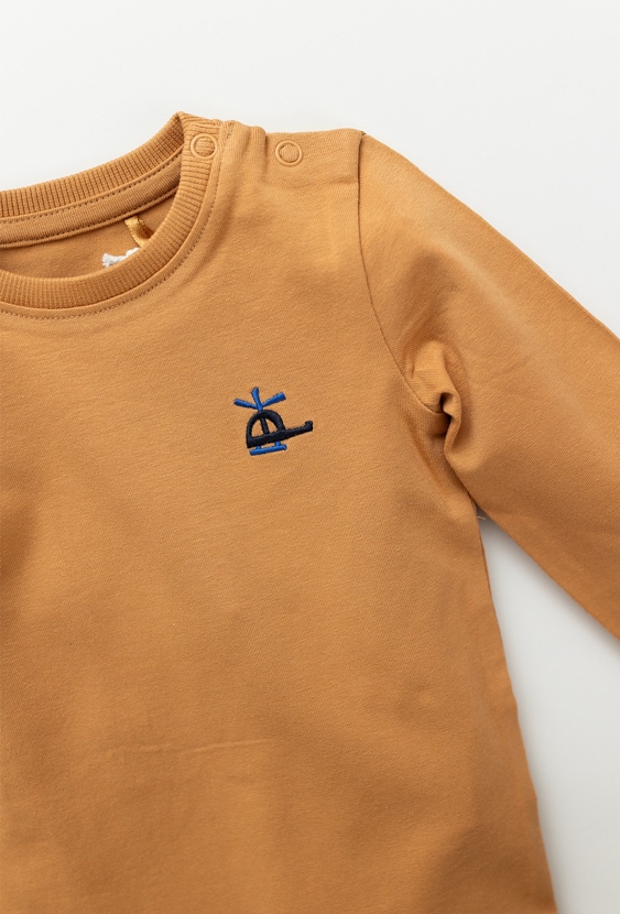 Beżowe body niemowlęce z długim rękawem i haftem samolotu